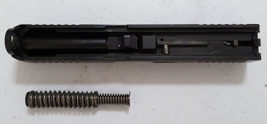 Recoil spring assembly removed